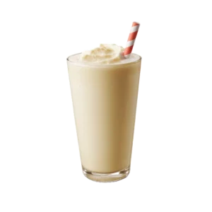 veliki karamel milkshake u čaši sa šlagom i slamkom
