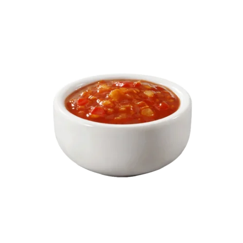 porcija ljutog paradajz sosa spicy tomato salsa u maloj posudi.