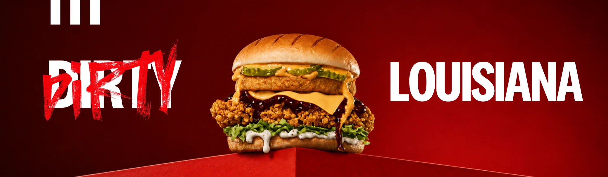 advertisement banner showing a fried chicken burger on a red background, with red brush-stroke 'dirty' and 'louisiana' in bold white text.